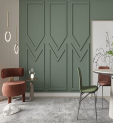 A living room with green wall panels, a simple chair, round lights, and decorations.