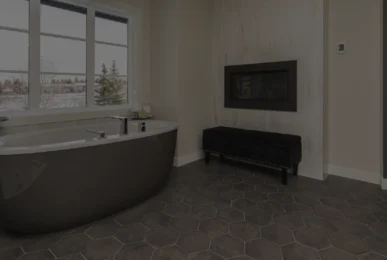 Modern bathroom with hexagonal tile flooring.
